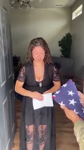 Widow performs fake cry with Sandy Hook style portrait
