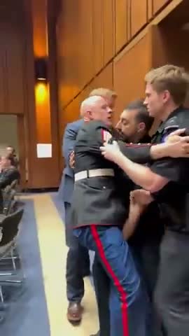 Scripted: US senator 'breaks hand' of retired marine for protesting war