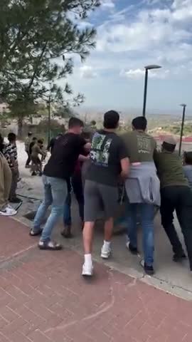 Jew kids play with stage prop from fake Iran war