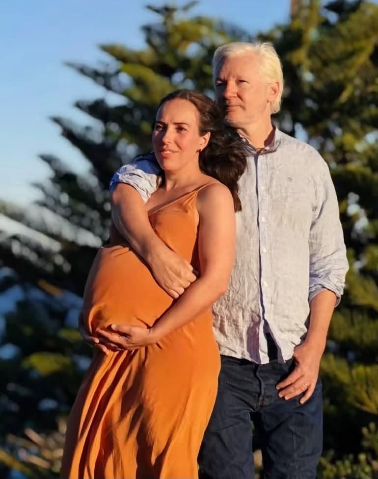Assange wife fake bump?