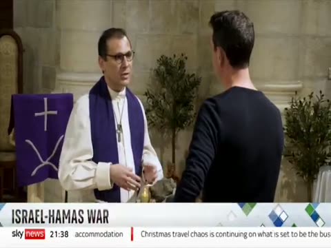 Freemason priest with rubble so-called 'baby Jesus'